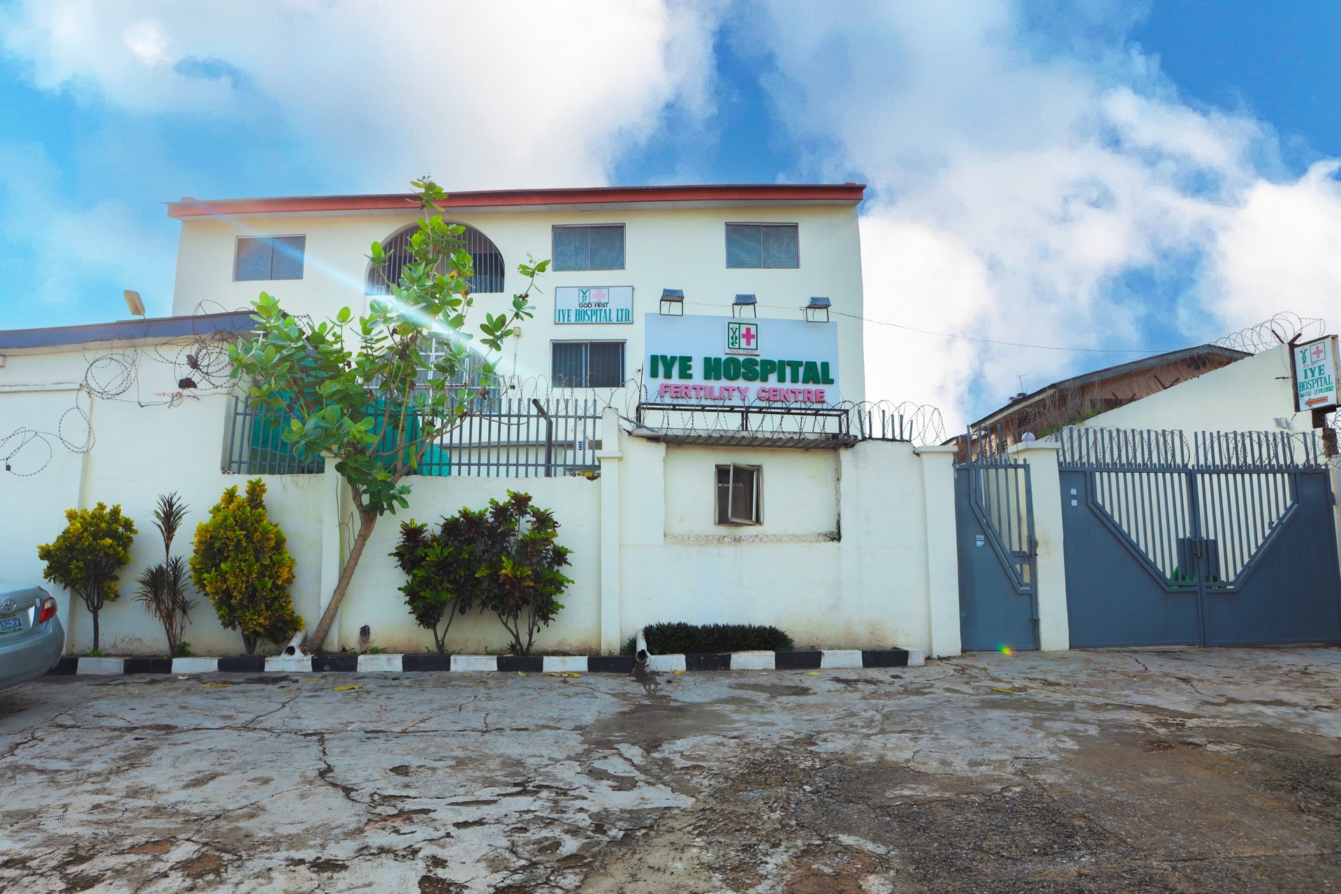 IYE Hospital building behind perimeter wall and entrance gate